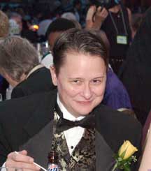 Szymanski in a tux at a fundraising gala.