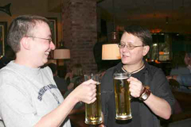 Me and Ruth toasting with mugs of beer at a pub.